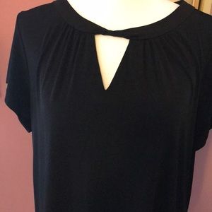 Susan Graver black top with twisted neckline.  Size Med.